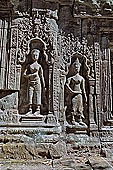 Ta Prohm temple - devatas sculpted on the gallery walls